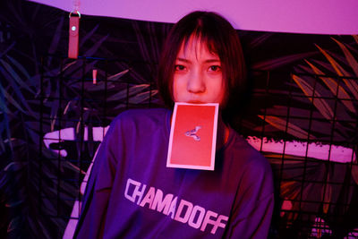 Portrait of teenage girl standing by text