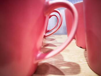 Close-up of pink and red light on table