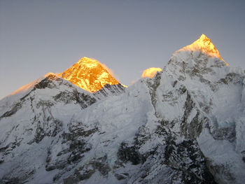 Low angle view of snow mountain against sky