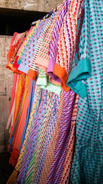 Close-up of multi colored flags hanging at market stall