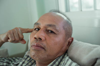 Close-up portrait of mid adult man