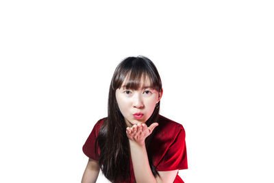 Portrait of a serious young woman over white background