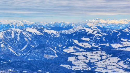 Scenic view of snowcapped mountains against sky