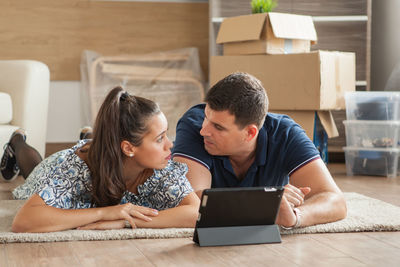 Businesswoman using laptop while sitting on table