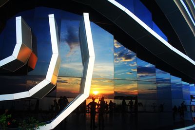 People at observation point against sky