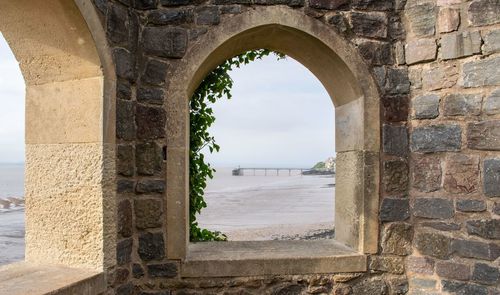 Buildings seen through arch window