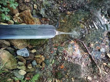 High angle view of water flowing from metal