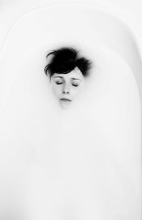 Portrait of young woman in bathroom