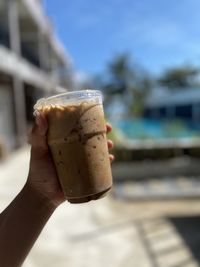 Close-up of hand holding ice cream cone