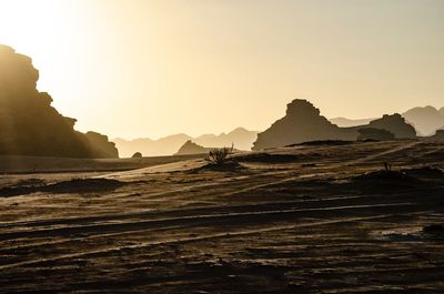 Scenic view of rocky mountains against sky during sunset