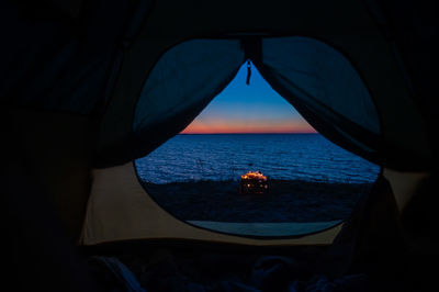 Scenic view of sea seen through window