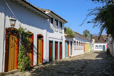 Footpath amidst buildings in town