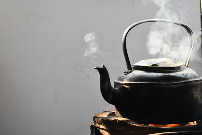 Close-up of tea cup against wall