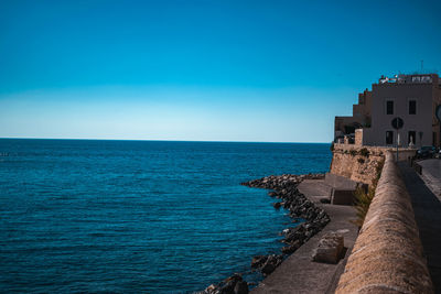 Scenic view of sea against blue sky