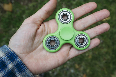Close-up of hand holding fidget spinner