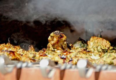 Close-up of meat on barbecue