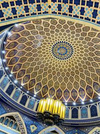 Directly below shot of ornate ceiling of building