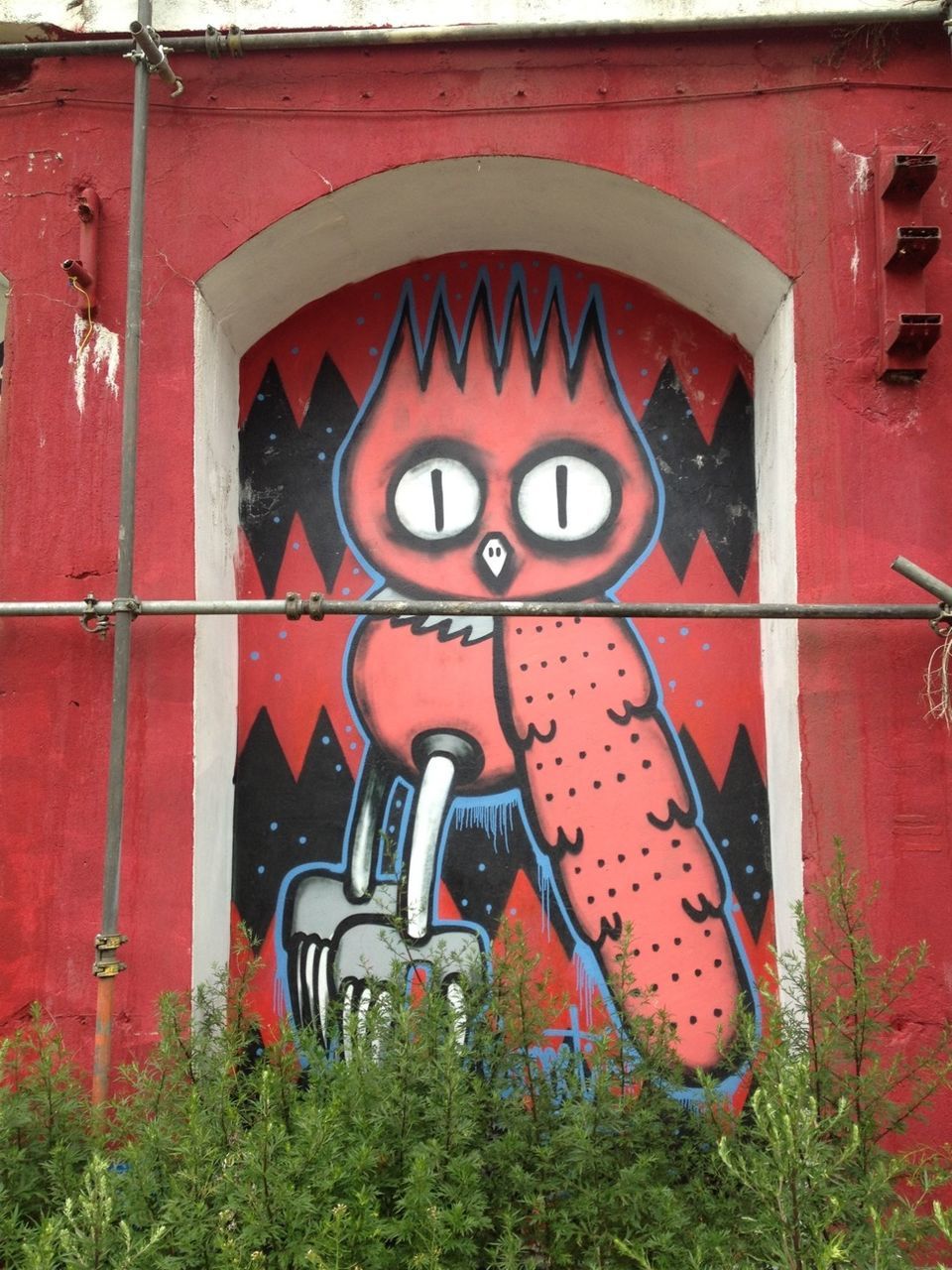 red, text, communication, western script, built structure, graffiti, architecture, wall - building feature, building exterior, outdoors, day, brick wall, abandoned, capital letter, no people, old, metal, safety, sign, number