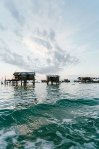 Scenic view of sea and buildings against sky