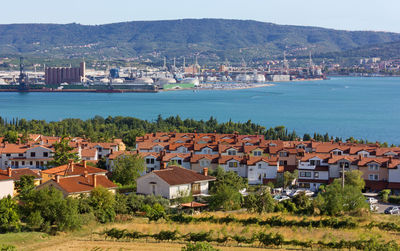 Seaside resort of ankaran, slovenia, with the seaport of koper in the backround