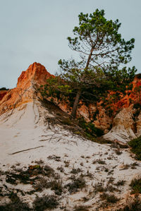 Rock formation on mountain against sky