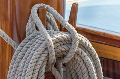 Close-up of rope tied to pier