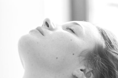 Close-up of woman face over black background