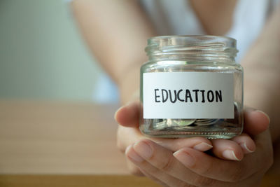 Close-up of woman holding jar