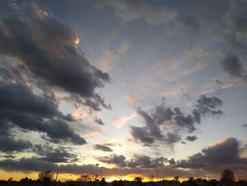 Low angle view of cloudy sky during sunset