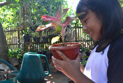 Side view of girl holding ice cream