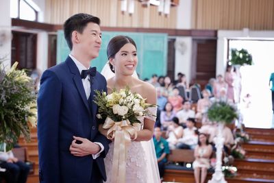 Happy young couple in church during wedding