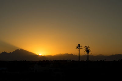 Scenic view of silhouette landscape against sky during sunset