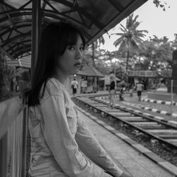 Portrait of woman at railroad station