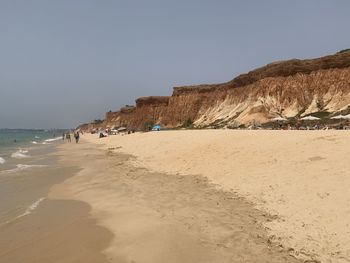 Scenic view of beach against clear sky