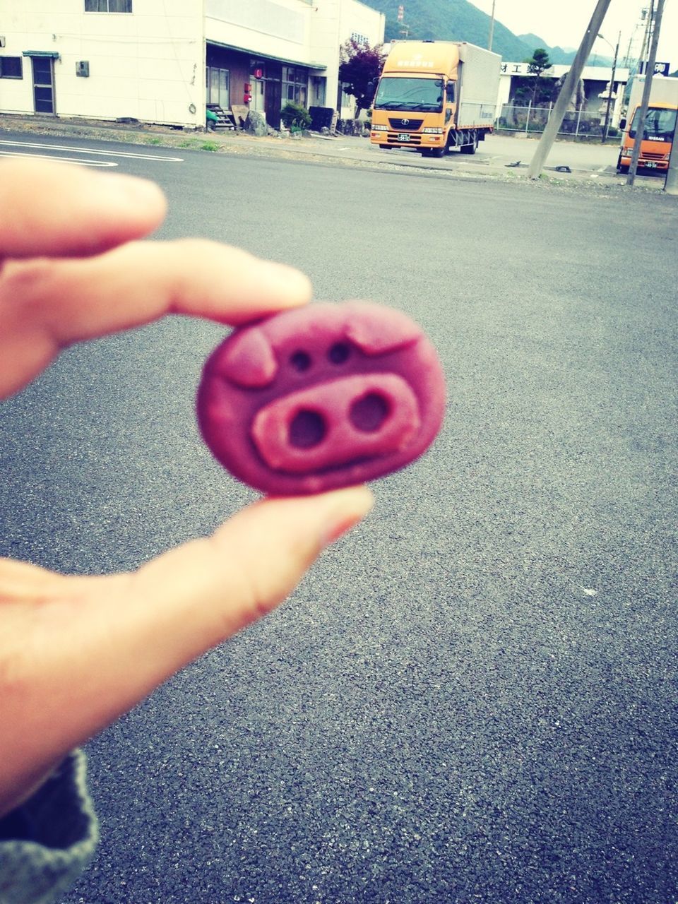 person, holding, part of, lifestyles, cropped, leisure activity, human finger, street, red, unrecognizable person, childhood, personal perspective, day, outdoors, men, pink color