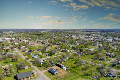 High angle view of buildings in city against sky