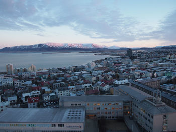 High angle view of city against cloudy sky