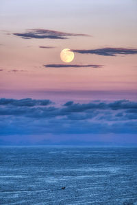 Scenic view of sea against romantic sky