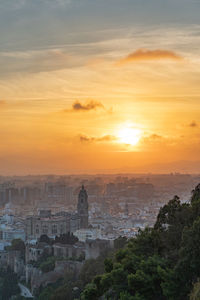 Aerial view of cityscape during sunset