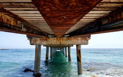 Rusty pier over mediterranean sea
