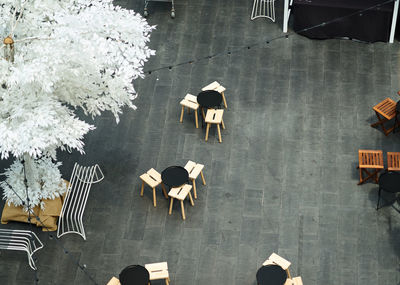 High angle view of tables and chairs in restaurant