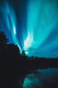 Scenic view of northern lights in sky at night
