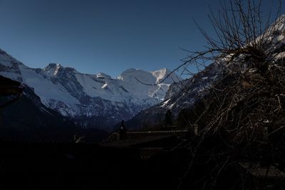 Scenic view of snowcapped mountains against clear sky