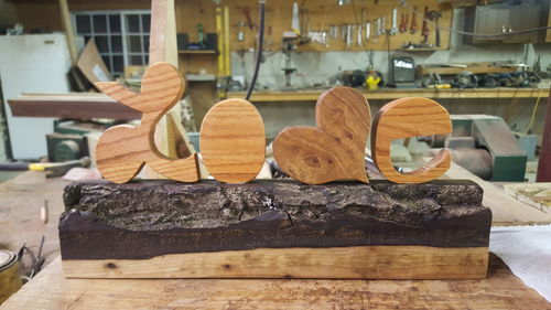 Close-up of shoes on wooden table