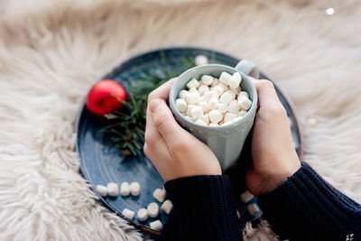 Midsection of woman holding food