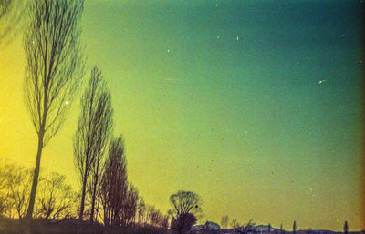 Scenic view of field against sky during sunset