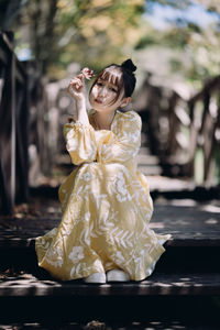 Portrait of young woman with bouquet