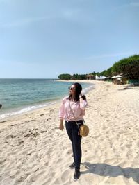 Full length of man standing on beach