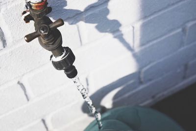 High angle view of water falling from faucet