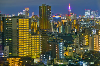 Illuminated buildings in city at night